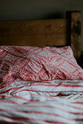 Red and white printed pillow and bedding