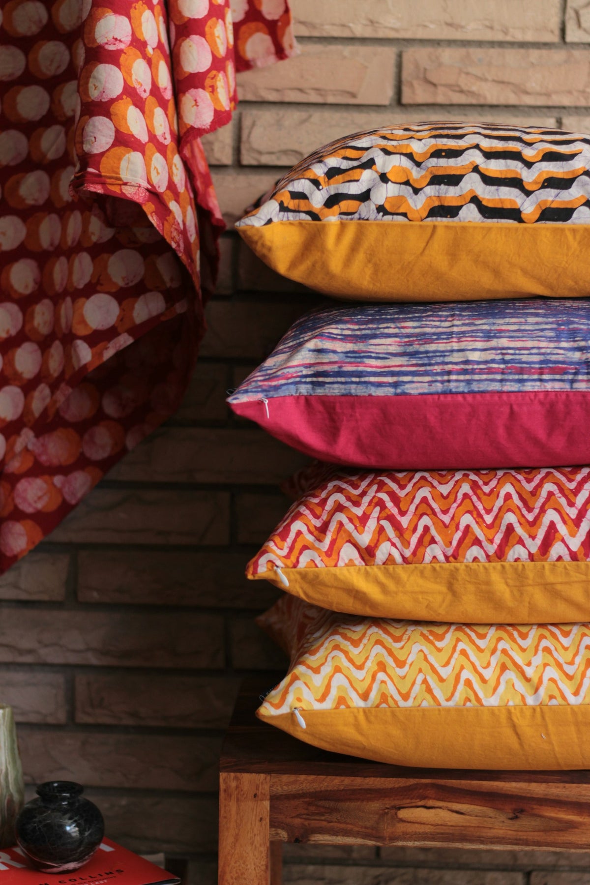 Stack of four patterned cushions