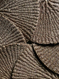 Round woven mats in brown and white