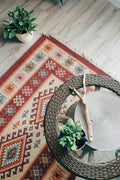 Red and white flat-woven patterned mat