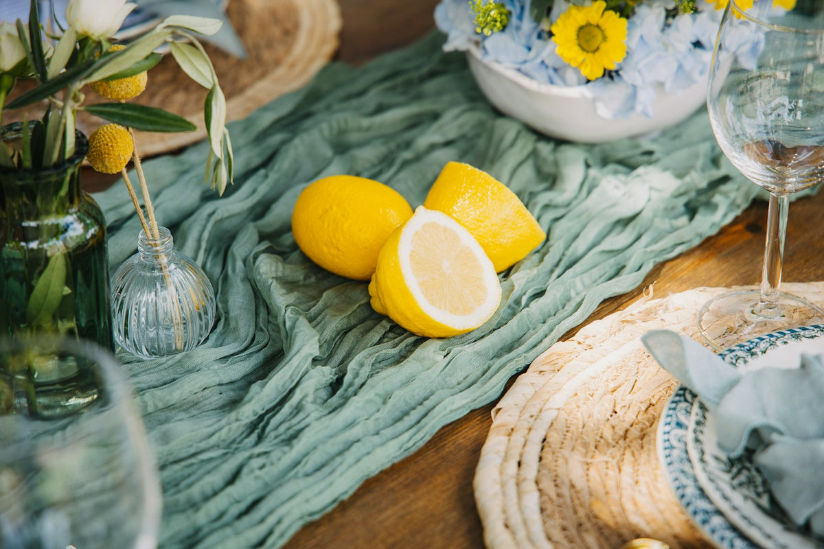 Green textured table runner with lemons