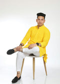 Man wearing a mustard yellow kurta