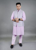 Man wearing a grey Modi jacket over a lilac kurta