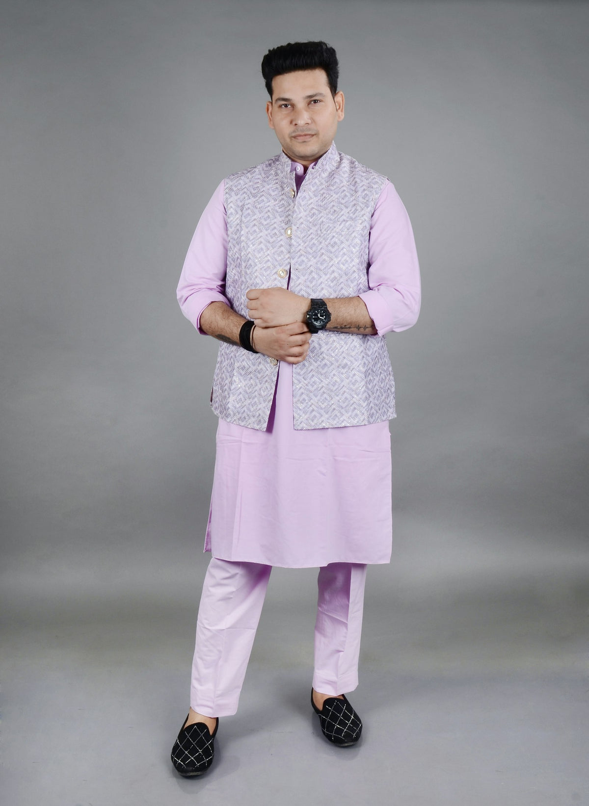 Man wearing a grey Modi jacket over a lilac kurta